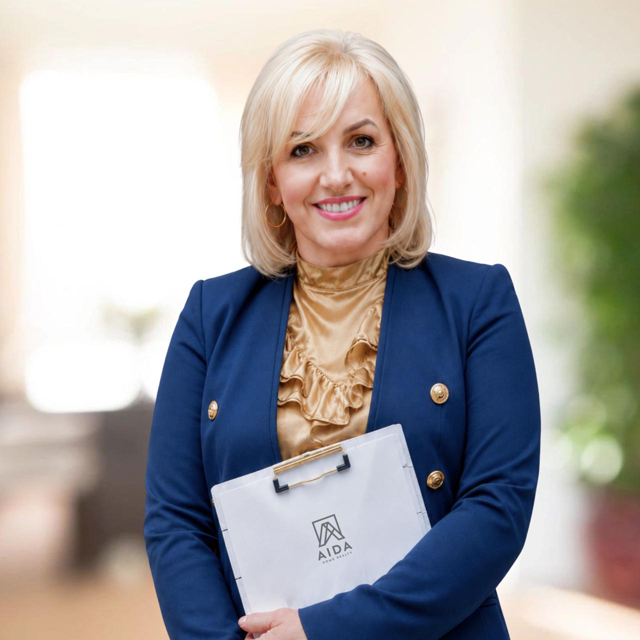 Professional portrait of AIDA Home Realty real estate agent